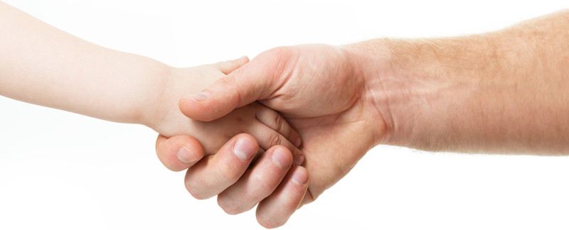 adult and child shake hands