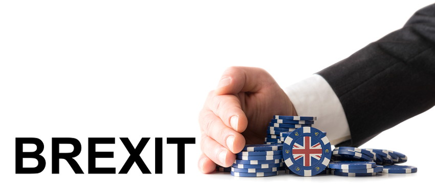 brexit man taking casino chips with uk flag