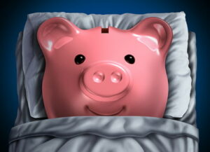 piggy bank lying in bed dormant