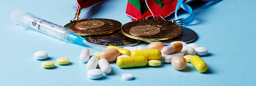 winners medals with pills syringe and drugs