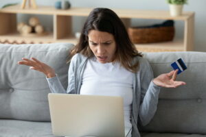 woman looking at computer baffled