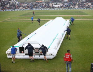 cricket match rain stops play covers being rolled out