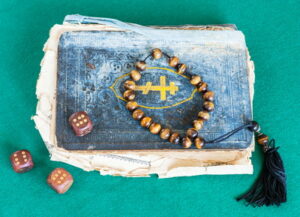 old psalms book beads and dice