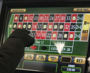 fixed odds betting terminal with game of roulette being played