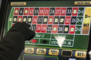 fixed odds betting terminal with game of roulette being played
