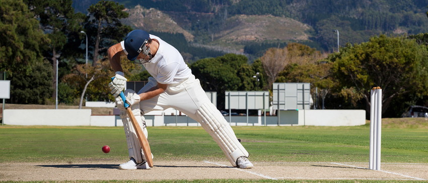 cricket batsman playing the ball down the ground