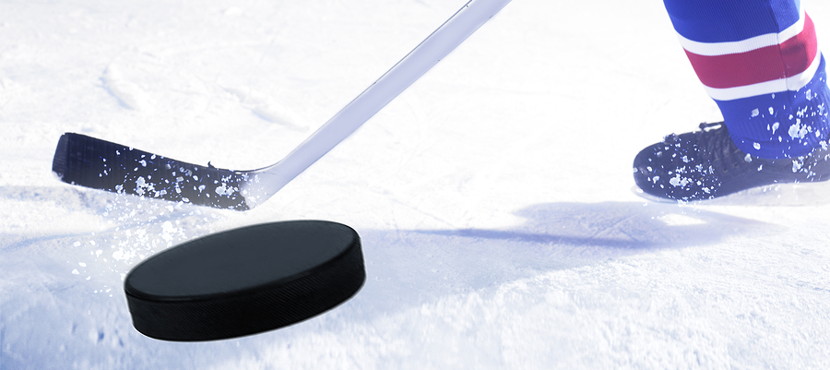 ice hockey puck being shot