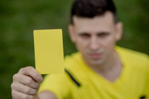 Referee Holding Yellow Card